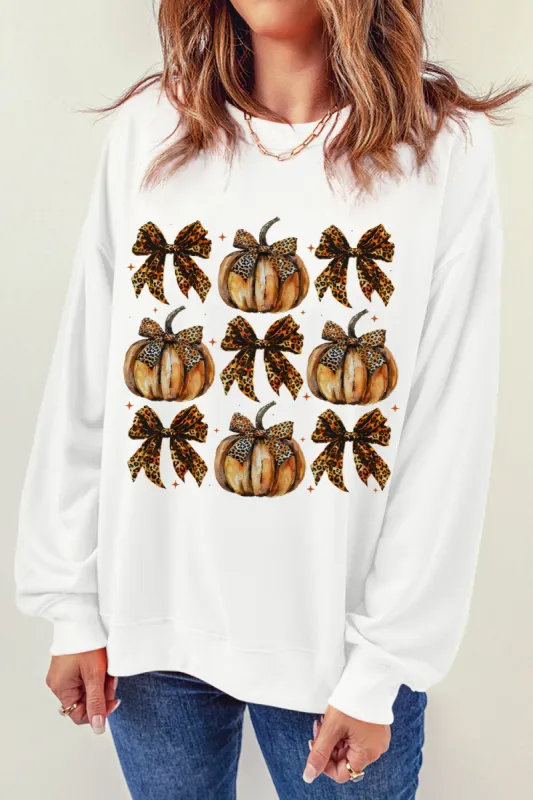 Pumpkin & Bow Graphic Long Sleeve Sweatshirt sold by Charming Charlie