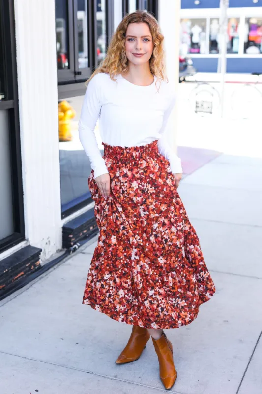 Casual Living Rust Floral Tiered Smocked Waist Midi Skirt sold by Charming Charlie