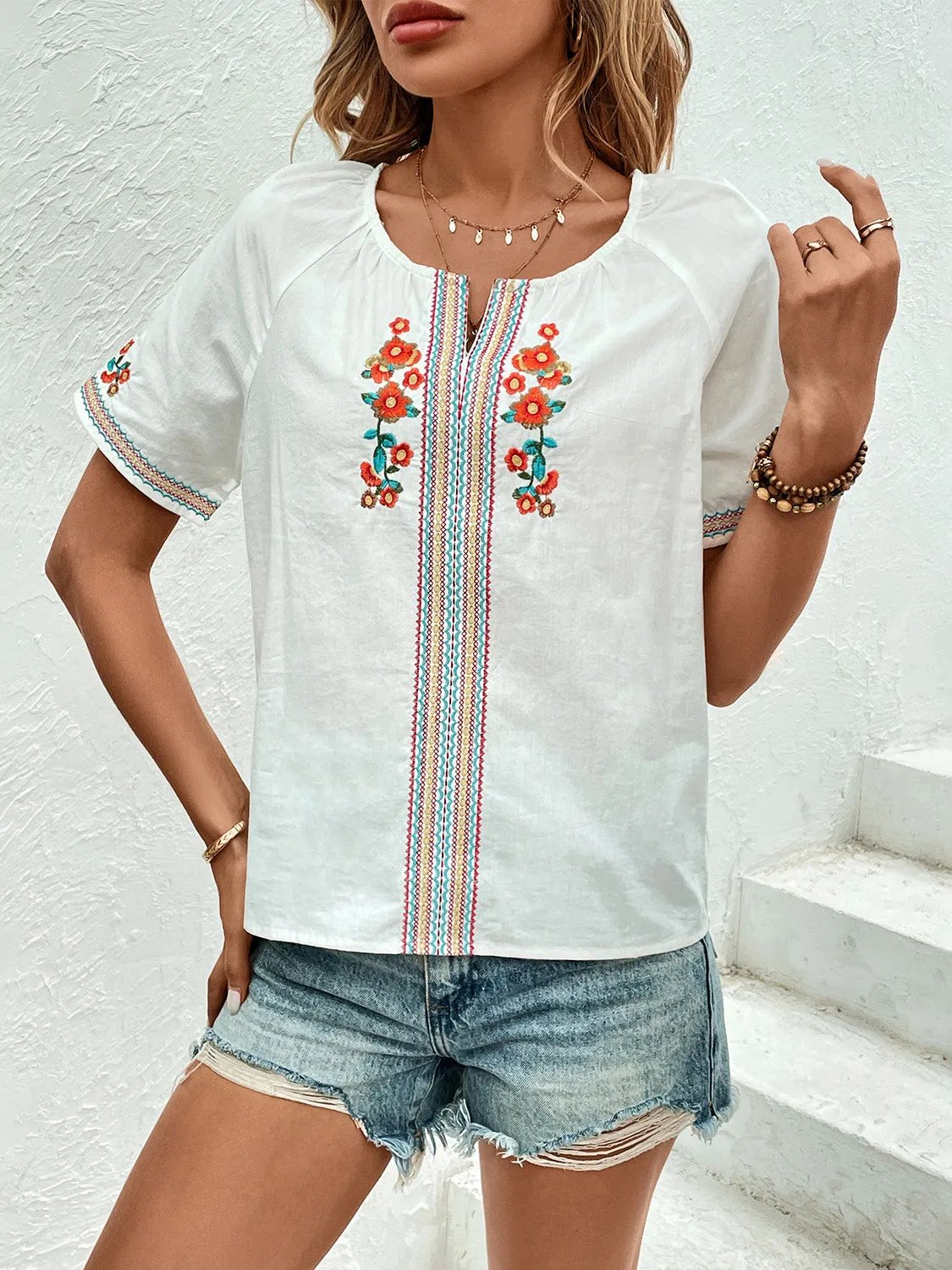 Embroidered Notched Short Sleeve Blouse sold by Charming Charlie