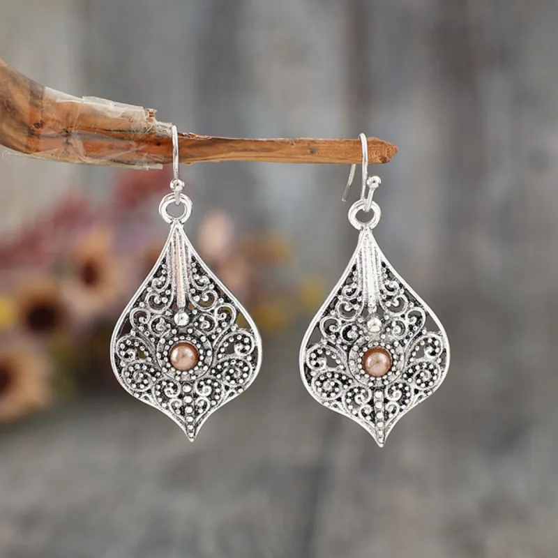 Silver-Plated Cutout Dangle Earrings sold by Charming Charlie