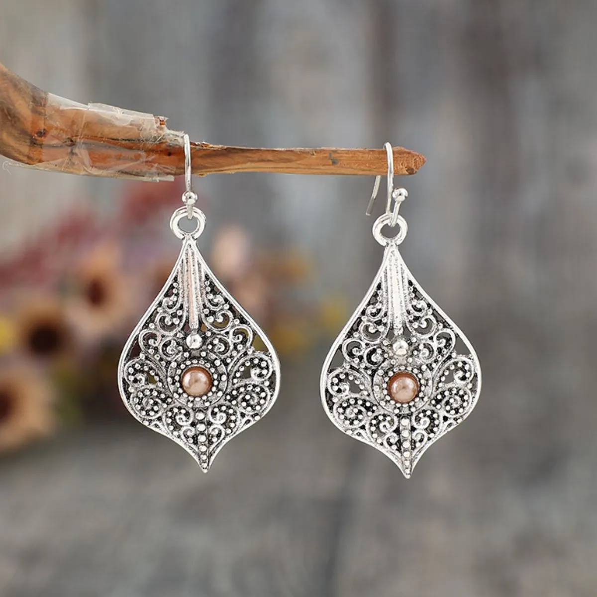 Silver-Plated Cutout Dangle Earrings sold by Charming Charlie