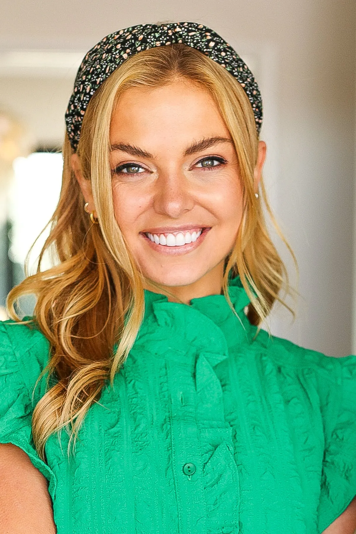 Black Floral Print Top Knot Headband sold by Charming Charlie