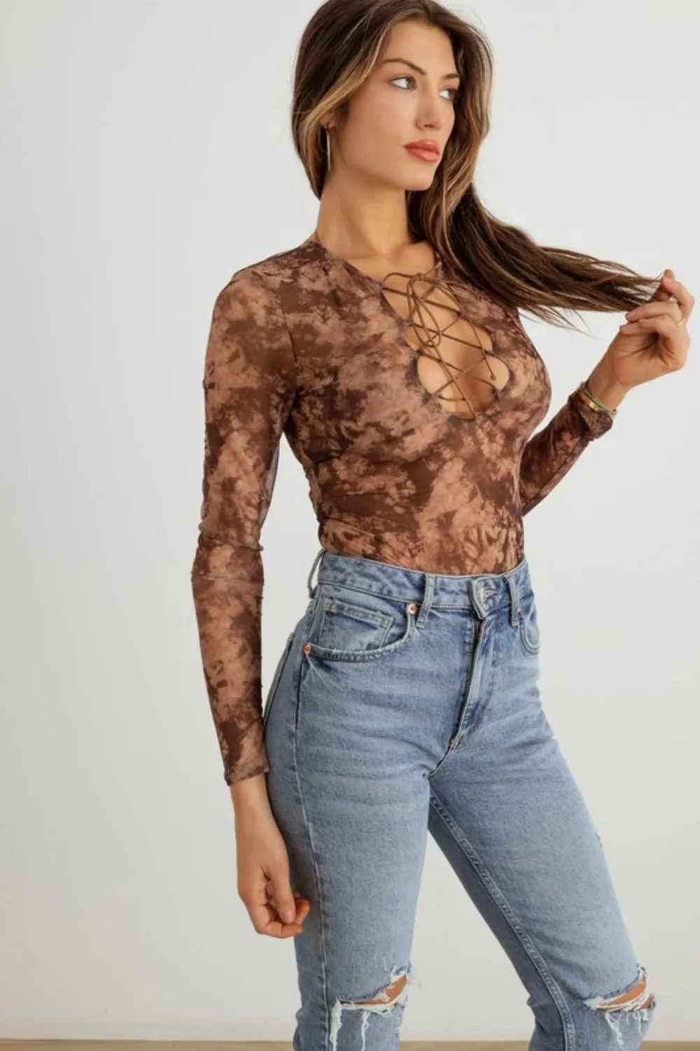 HERA COLLECTION Abstract Mesh Lace-Up Long Sleeve Bodysuit sold by Charming Charlie product image thumbnail 3