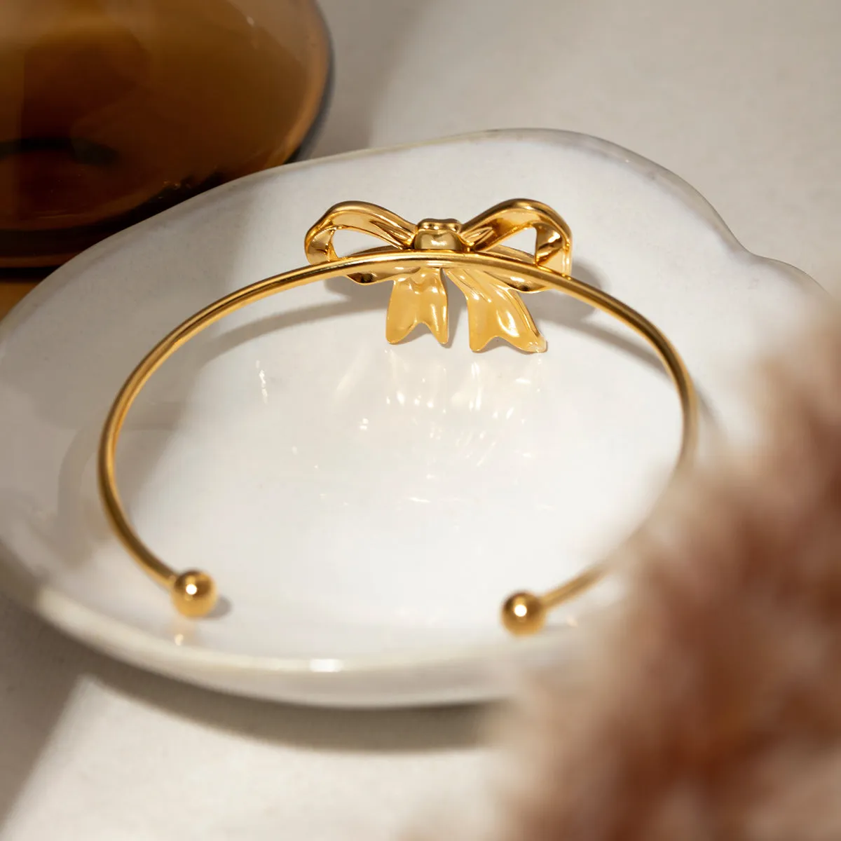 18K Gold-Plated Stainless Steel Bow Bracelet sold by Charming Charlie product image thumbnail 3