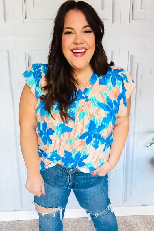Tropical Breeze Turquoise Floral Banded V Neck Flutter Sleeve Top sold by Charming Charlie