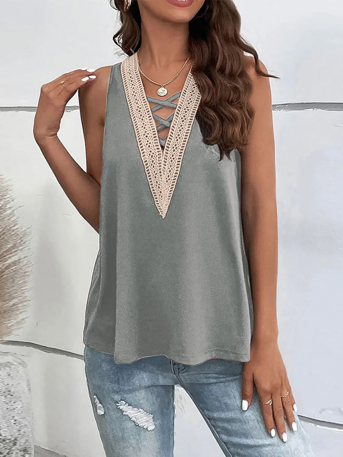 Crisscross V-Neck Tank sold by Charming Charlie
