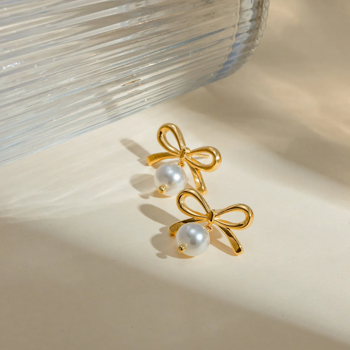 Stainless Steel Bow Pearl Earrings sold by Charming Charlie product image thumbnail 3