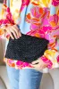 Black Raffia Woven Wrist Strap Clutch Bag sold by Charming Charlie