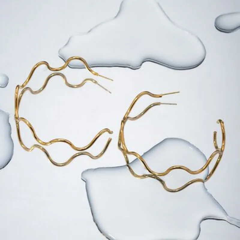 Stainless Steel Wave Shape C-Hoop Earrings sold by Charming Charlie