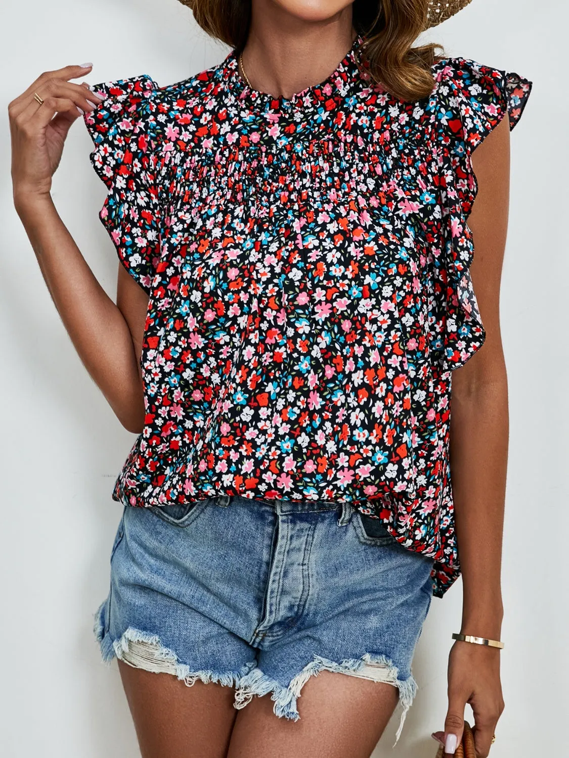 Ruffled Ditsy Floral Mock Neck Cap Sleeve Blouse sold by Charming Charlie