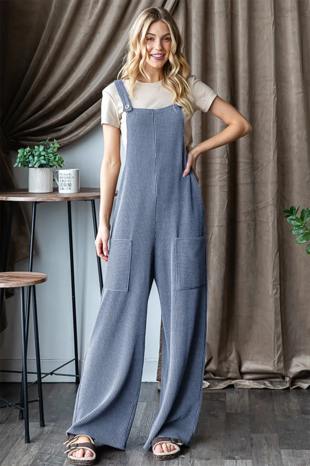Heimish Full Size Ribbed Front Pocket Sleeveless Jumpsuit sold by Charming Charlie