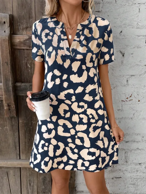 Printed Notched Short Sleeve Mini Dress sold by Charming Charlie