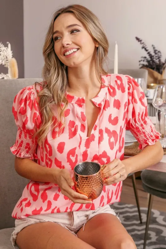 BiBi Leopard Smocked Short Sleeve Blouse sold by Charming Charlie