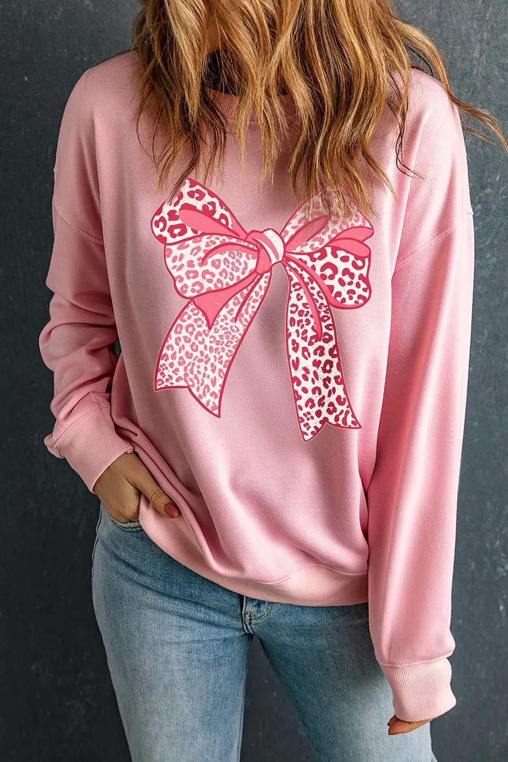 Bow Graphic Round Neck Long Sleeve Sweatshirt sold by Charming Charlie