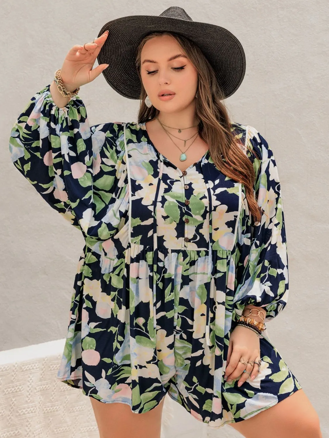 Plus Size Tied Printed Long Sleeve Romper sold by Charming Charlie