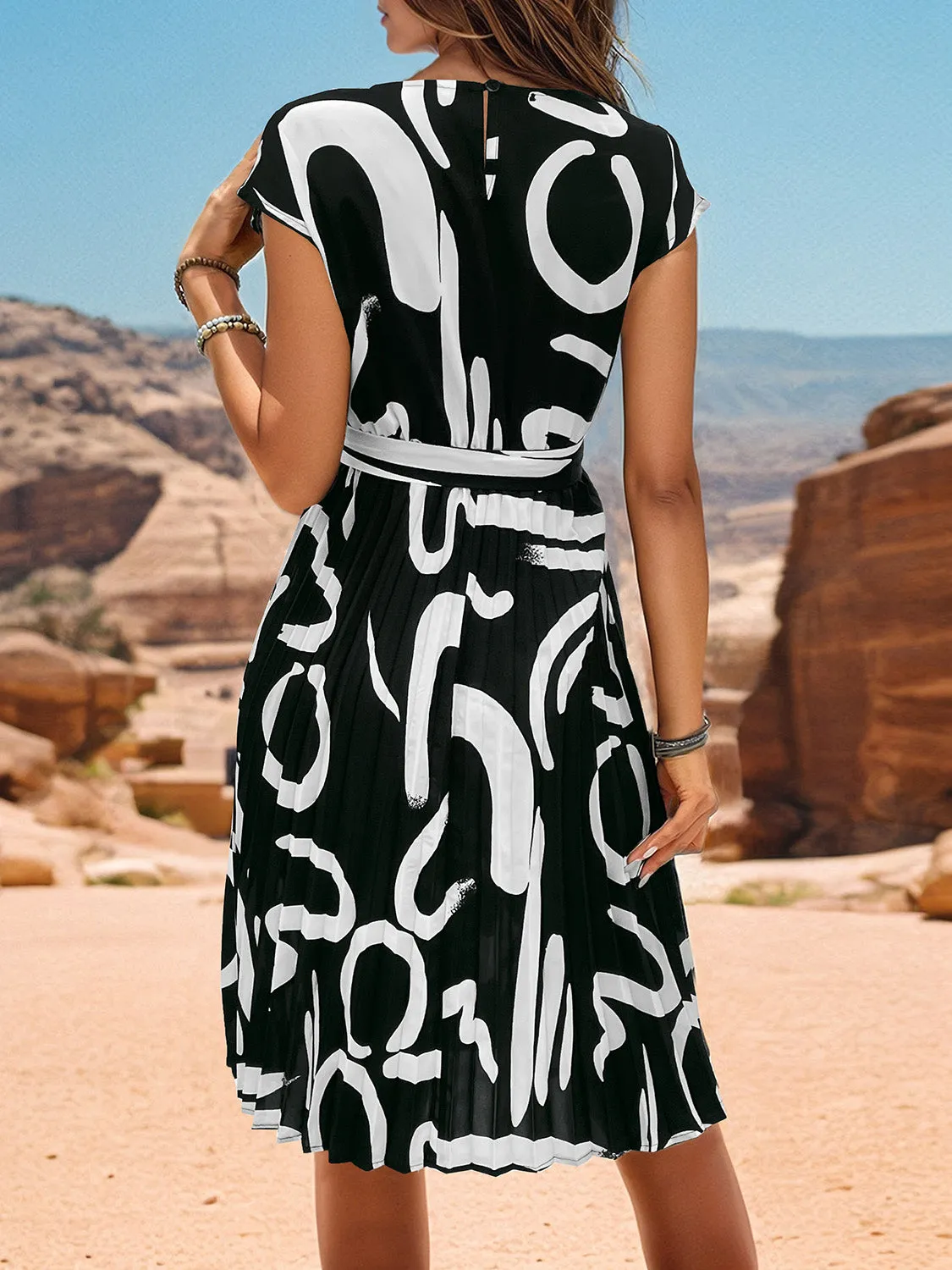 Printed Cap Sleeve Tie Waist Dress sold by Charming Charlie product image thumbnail 3