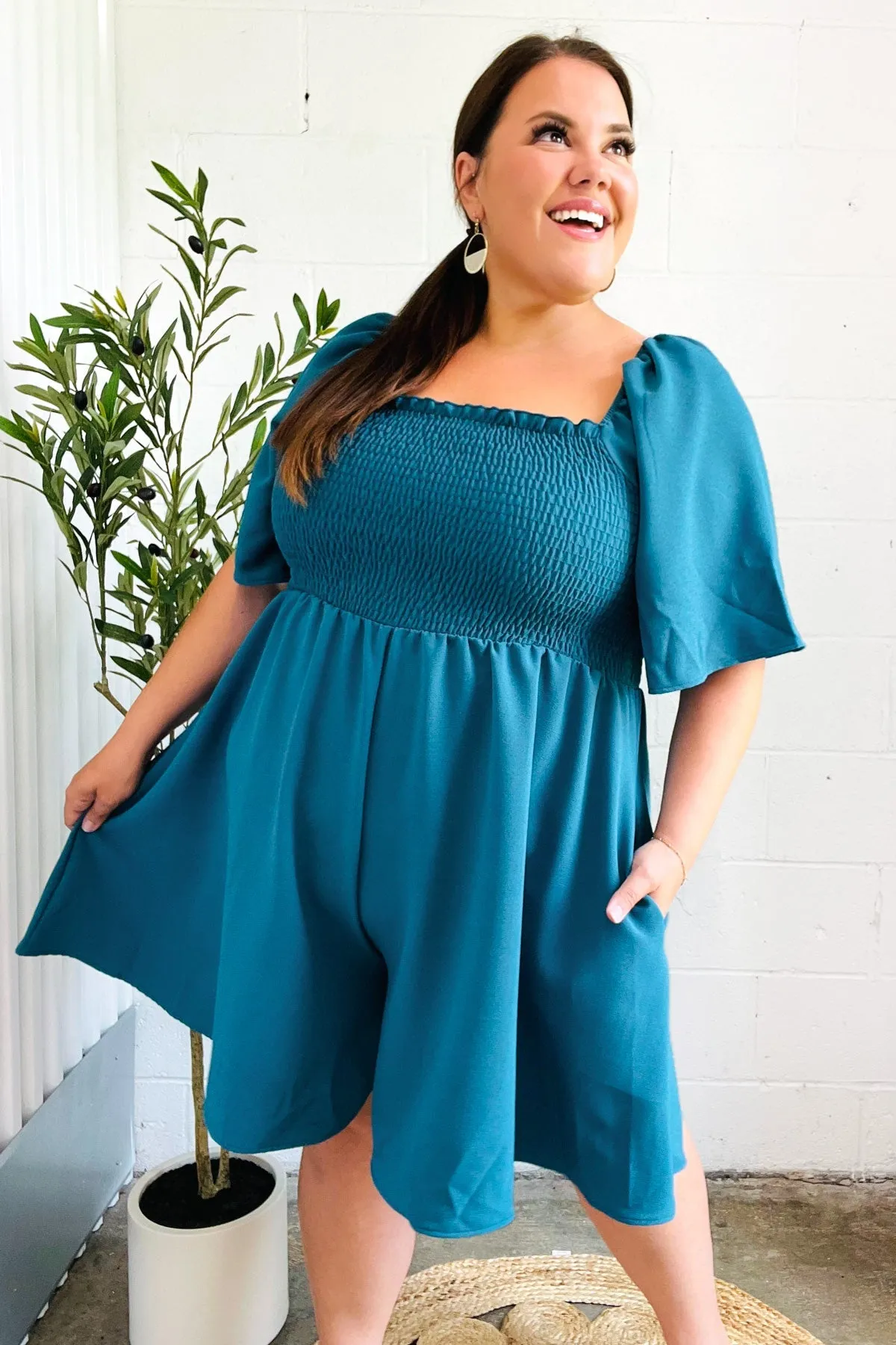 Feeling Playful Teal Smocked Flutter Sleeve Romper sold by Charming Charlie product image thumbnail 5