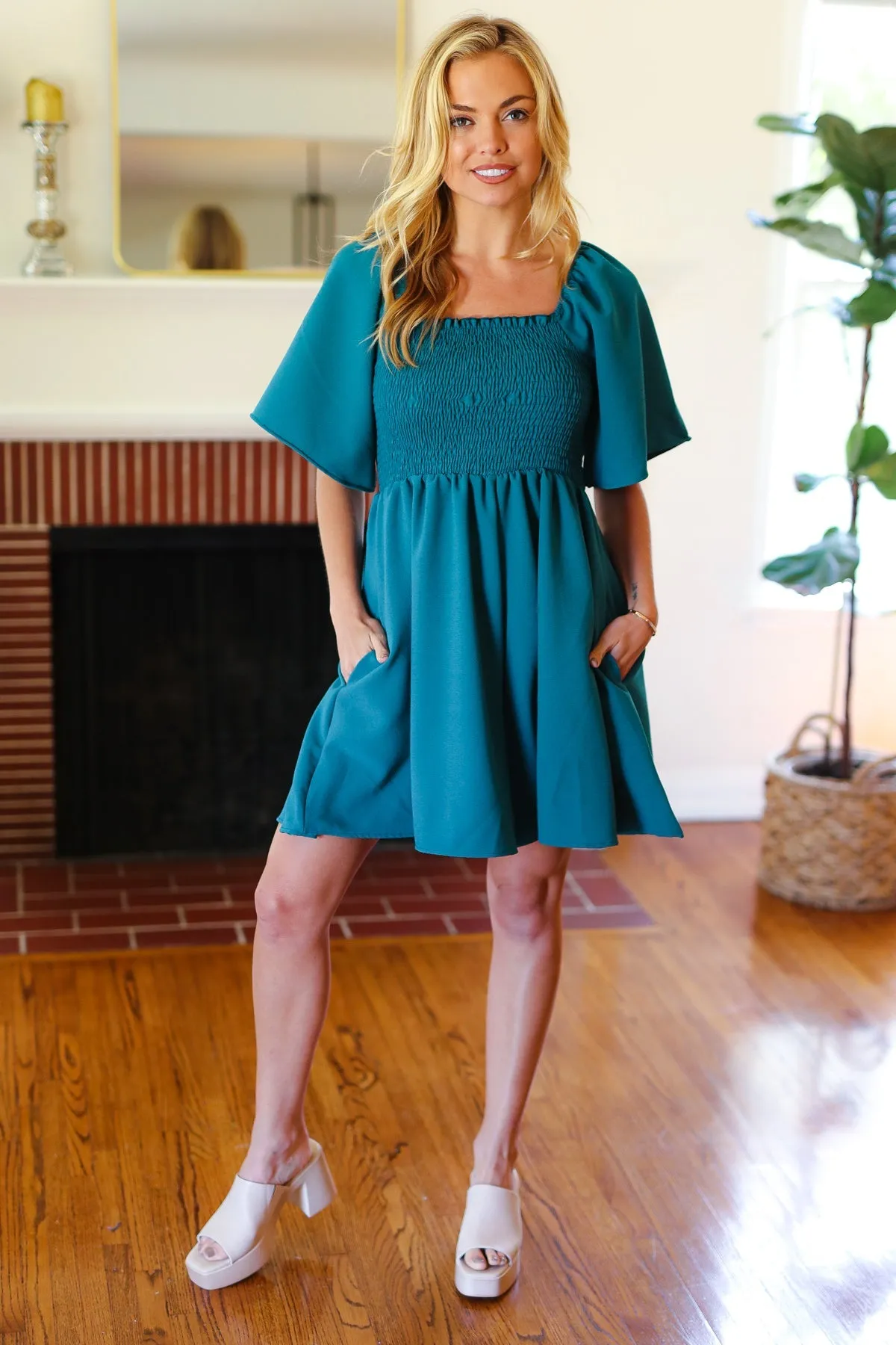 Feeling Playful Teal Smocked Flutter Sleeve Romper sold by Charming Charlie product image thumbnail 3