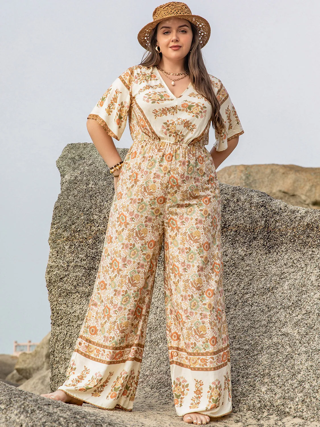Plus Size V-Neck Flutter Sleeve Wide Leg Jumpsuit sold by Charming Charlie product image thumbnail 4
