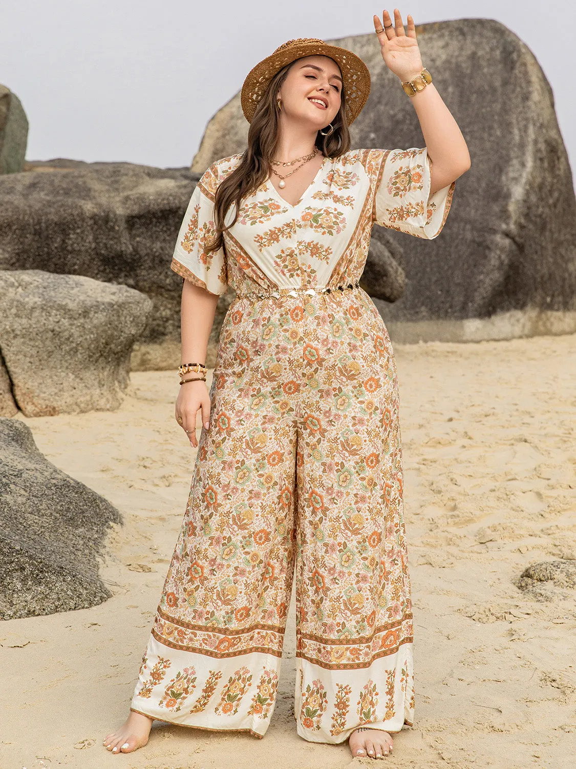 Plus Size V-Neck Flutter Sleeve Wide Leg Jumpsuit sold by Charming Charlie