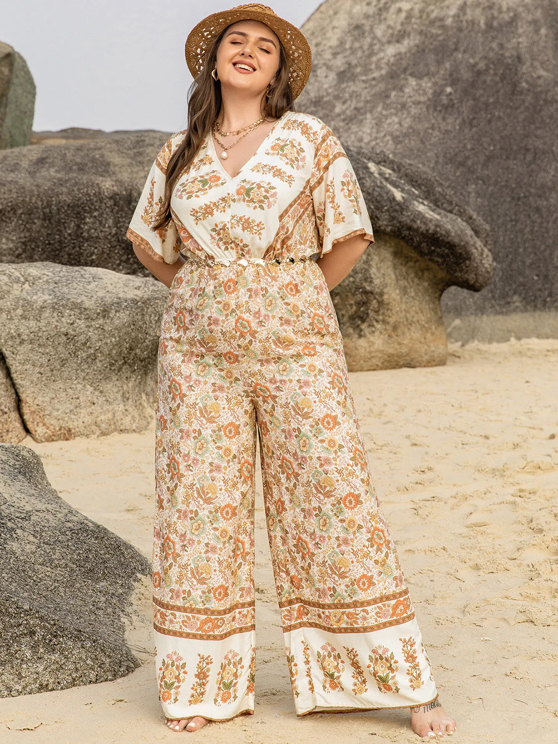Plus Size V-Neck Flutter Sleeve Wide Leg Jumpsuit sold by Charming Charlie product image thumbnail 5