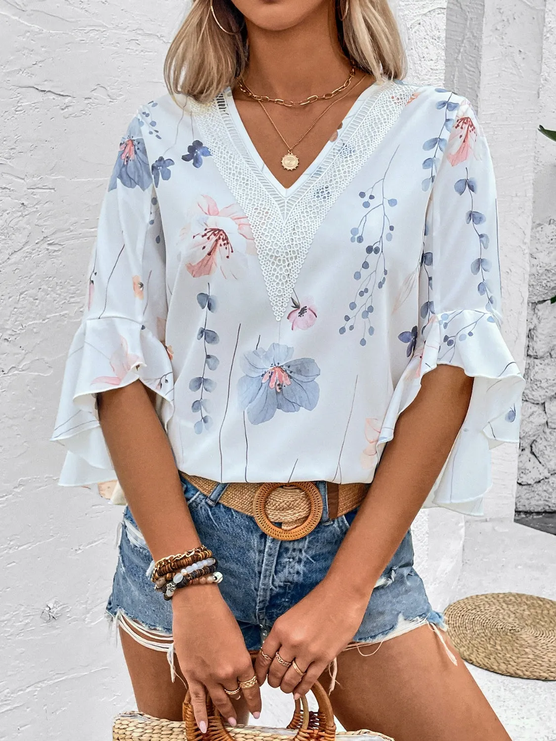 Ruffled Printed V-Neck Half Sleeve Blouse sold by Charming Charlie