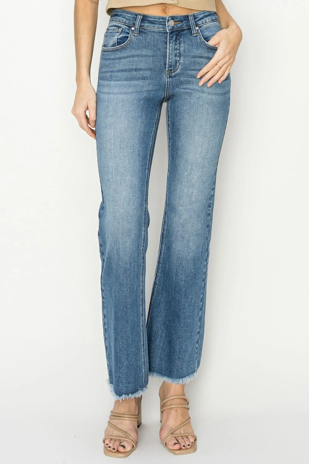 RISEN Mid-Rise Frayed Hem Bootcut Jeans sold by Charming Charlie