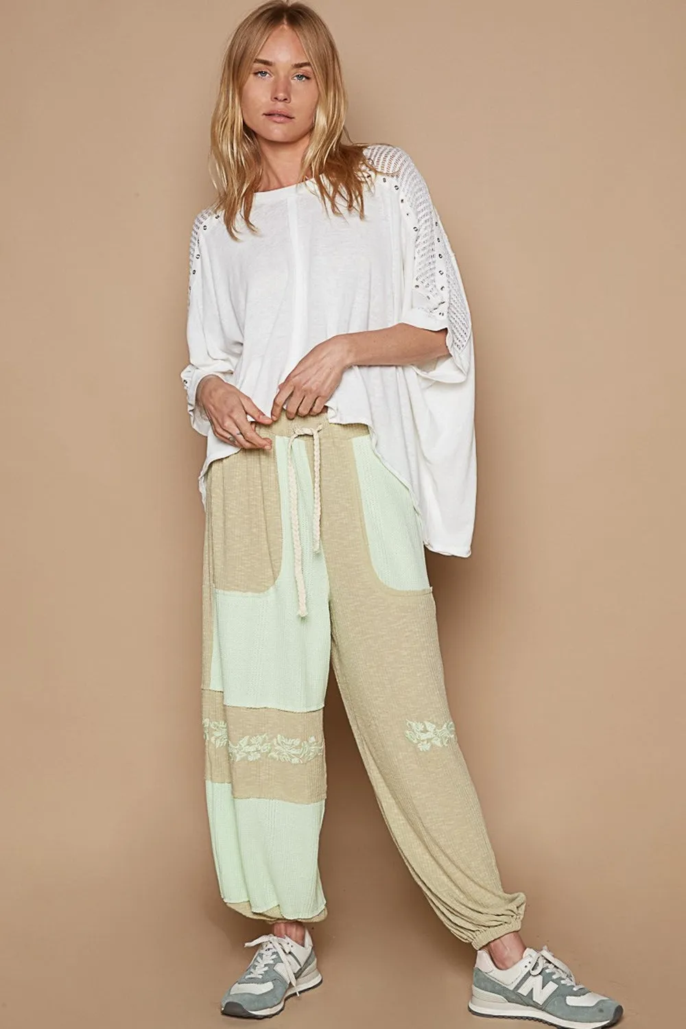 POL Eyelet Detail Studded High-Low Top sold by Charming Charlie product image thumbnail 5