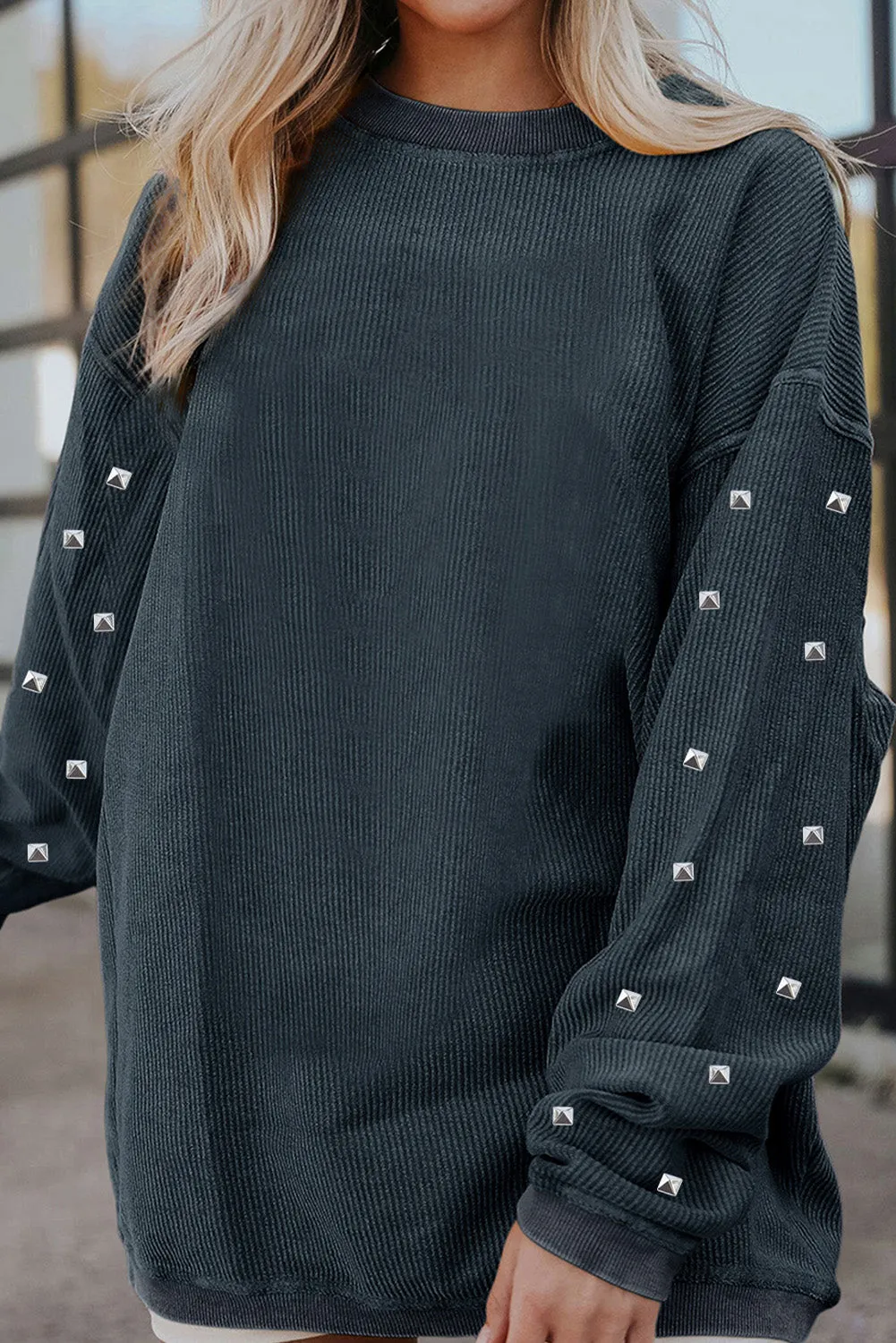 Studded Round Neck Long Sleeve Sweatshirt sold by Charming Charlie