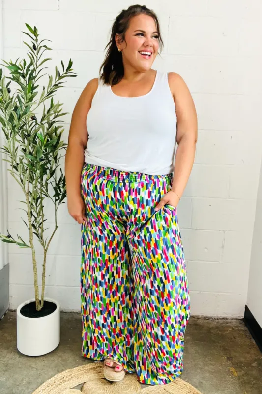 Stand Out Navy & Green Abstract Print Smocked Waist Palazzo Pants sold by Charming Charlie