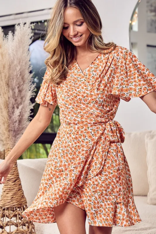 BiBi Floral Tied Short Sleeve Mini Wrap Dress sold by Charming Charlie