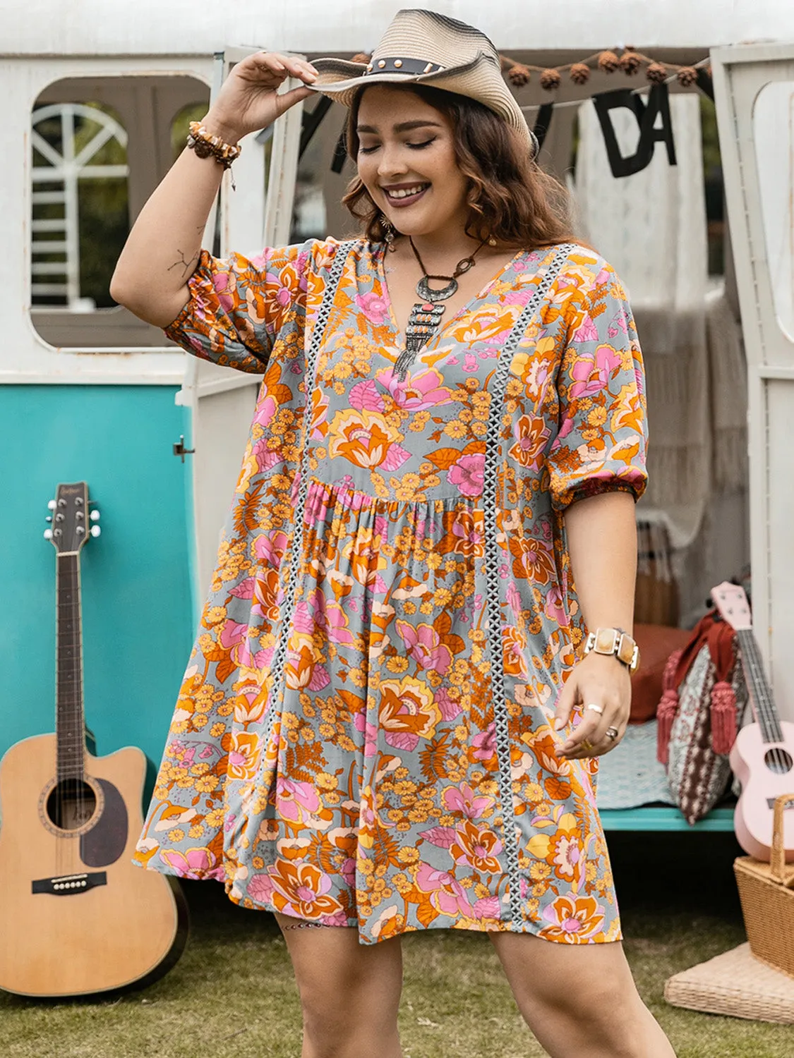 Plus Size Ruched Printed Half Sleeve Mini Dress sold by Charming Charlie