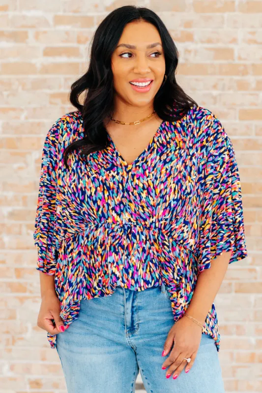 Dreamer Peplum Top in Painted Royal Multi sold by Charming Charlie