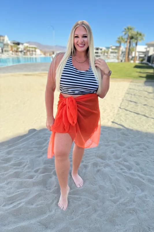 Wrapped In Summer Versatile Swim Cover in Orange sold by Charming Charlie