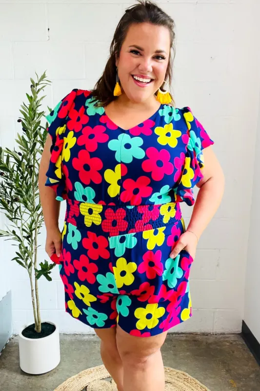 Feeling Bold Navy & Fuchsia Flat Floral Smocked Waist Flutter Sleeve Romper sold by Charming Charlie