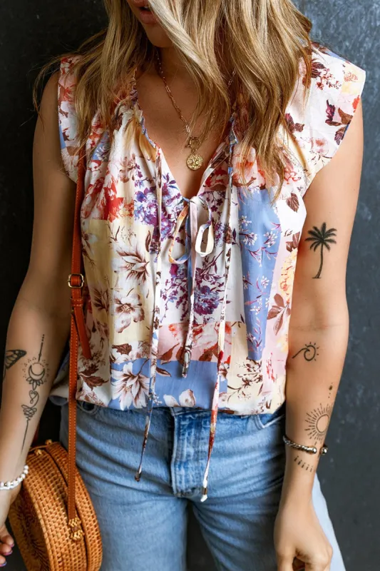 Printed Tie Neck Cap Sleeve Blouse sold by Charming Charlie
