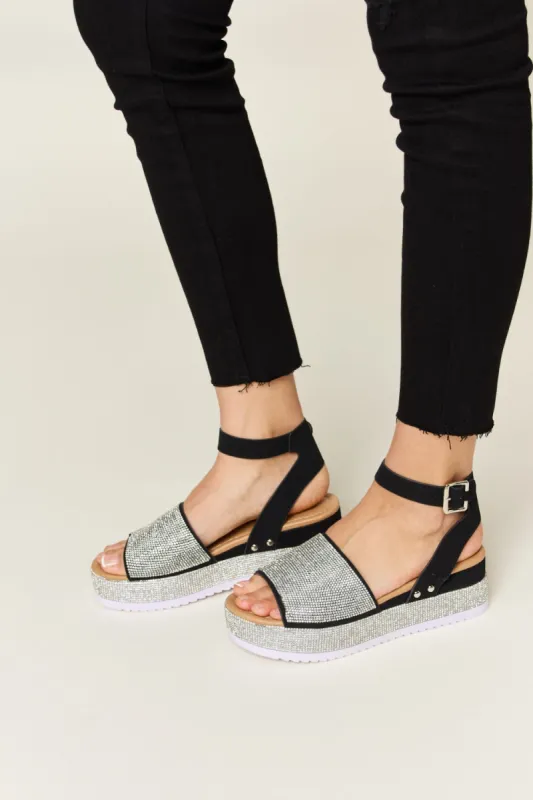 Forever Link Rhinestone Buckle Strappy Wedge Sandals sold by Charming Charlie