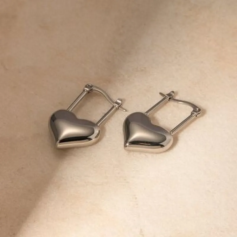 Stainless Steel Heart Lock Drop Earrings sold by Charming Charlie