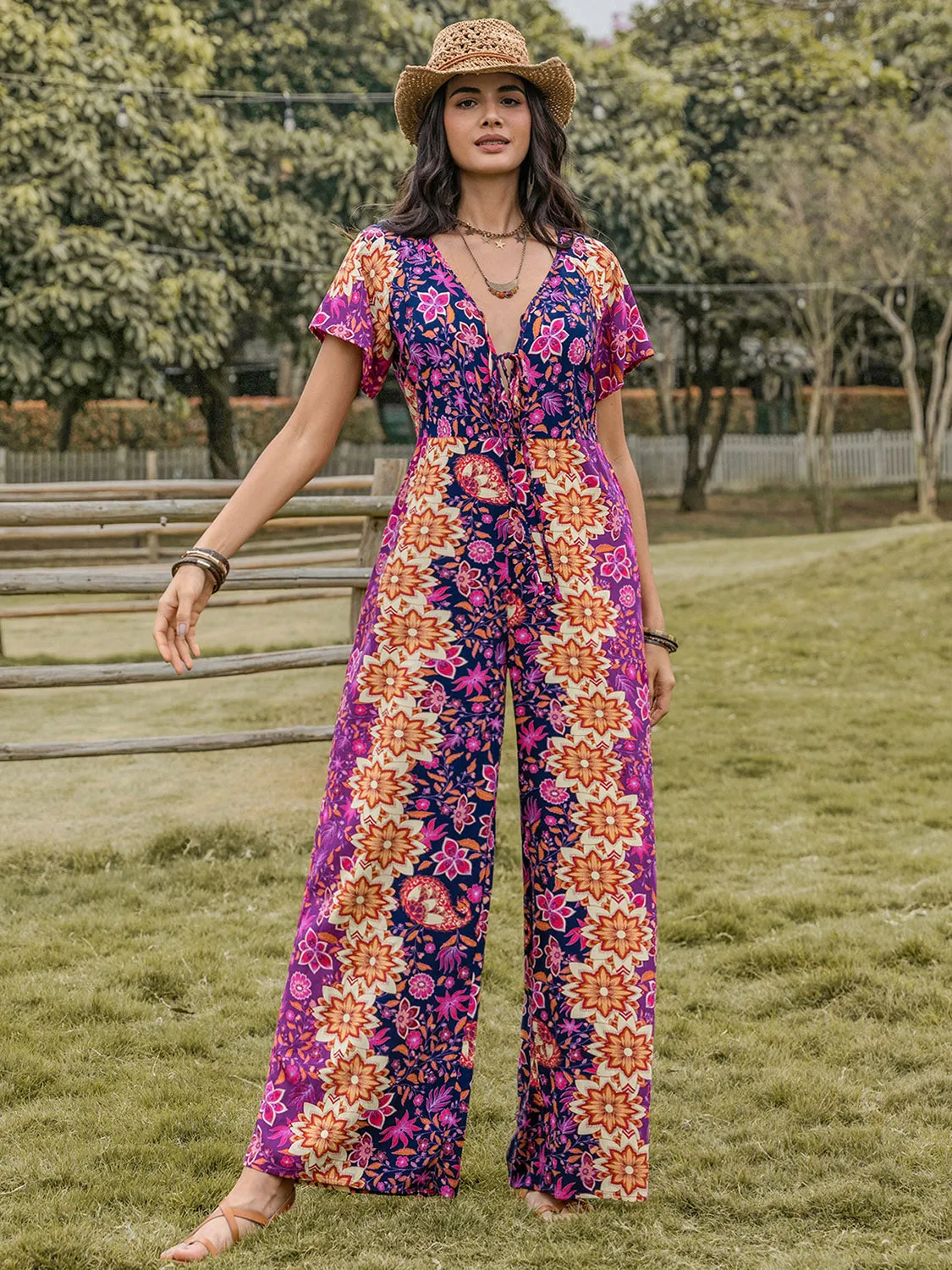 Tied V-Neck Short Sleeve Jumpsuit sold by Charming Charlie