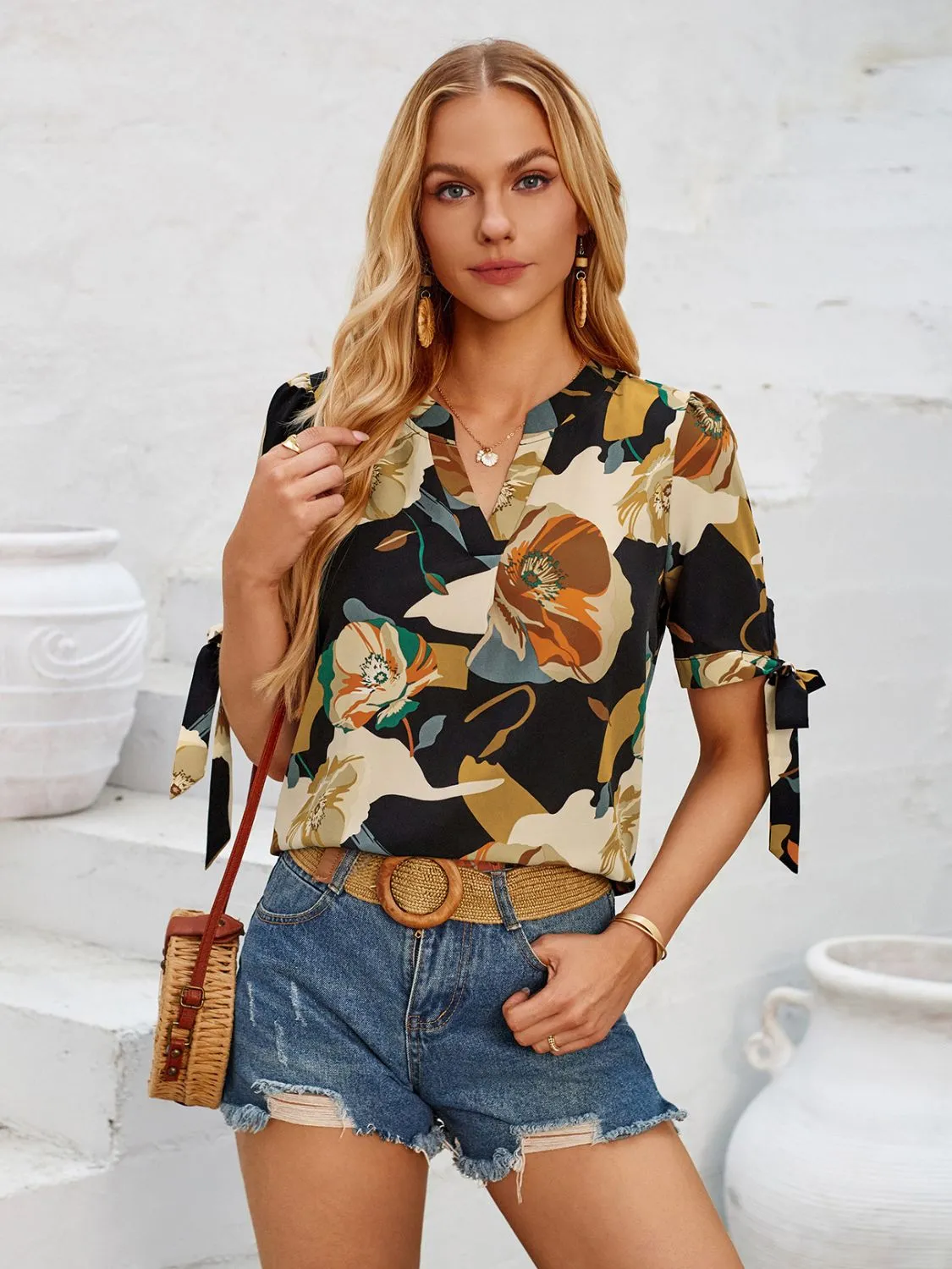 Tied Printed Notched Short Sleeve Blouse sold by Charming Charlie product image thumbnail 4