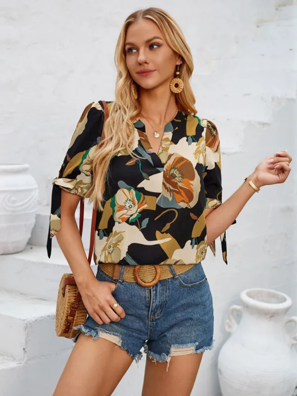 Tied Printed Notched Short Sleeve Blouse sold by Charming Charlie