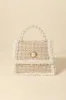 Fame Pearly Trim Woven Handbag sold by Charming Charlie