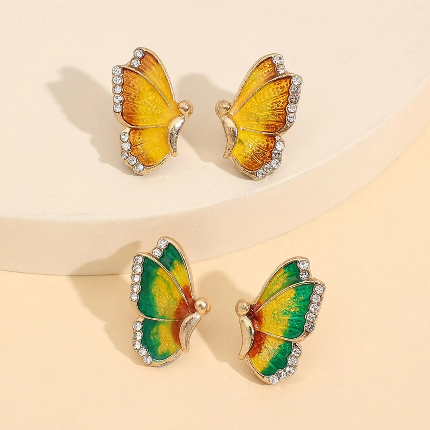 2 Piece Rhinestone Alloy Butterfly Stud Earrings sold by Charming Charlie