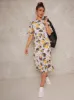 Flutter Sleeve Floral Print Midi Day Dress in White sold by Chi Chi London