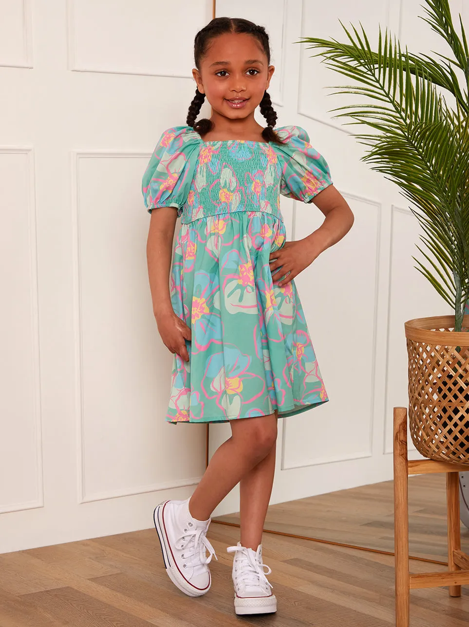 Younger Girls Puff Sleeve Shirred Floral Midi Dress in Green sold by Chi Chi London