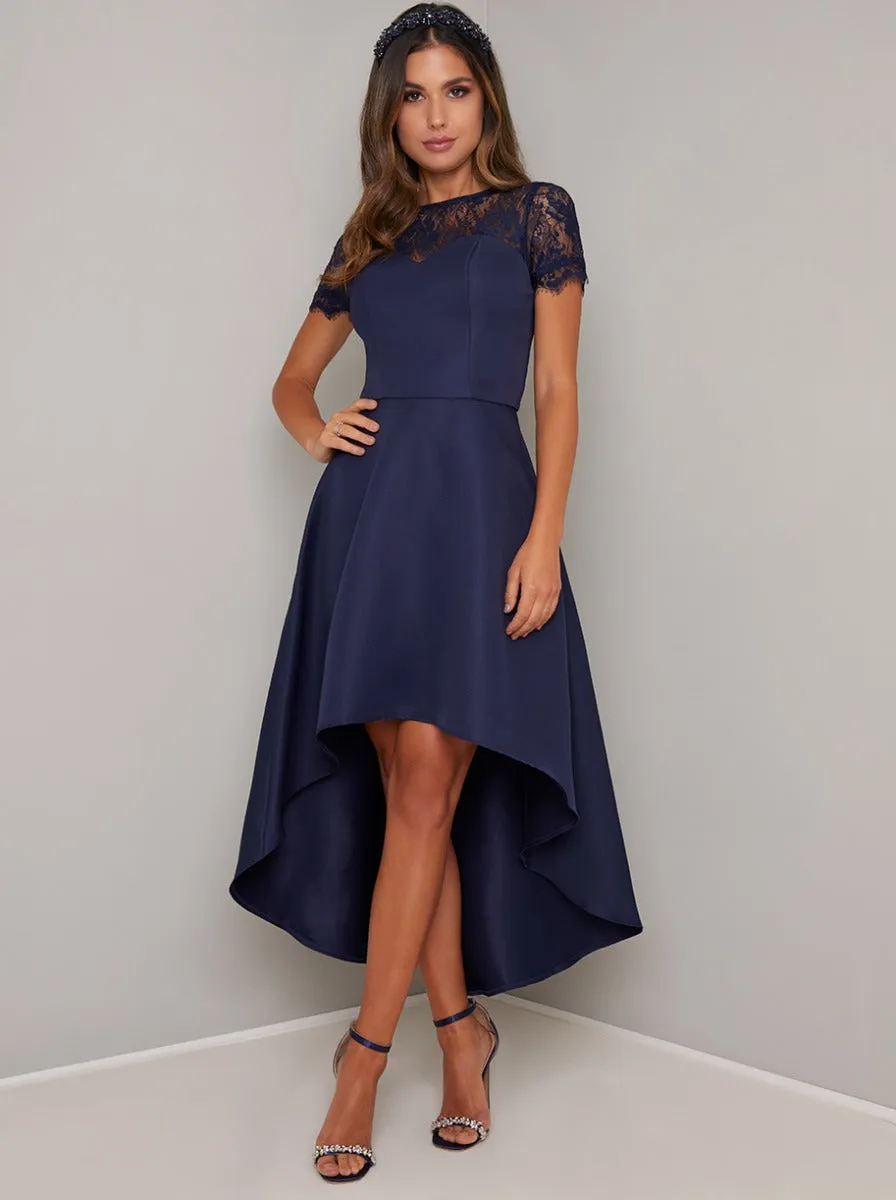 Dip Hem Lace Dress in Blue sold by Chi Chi London