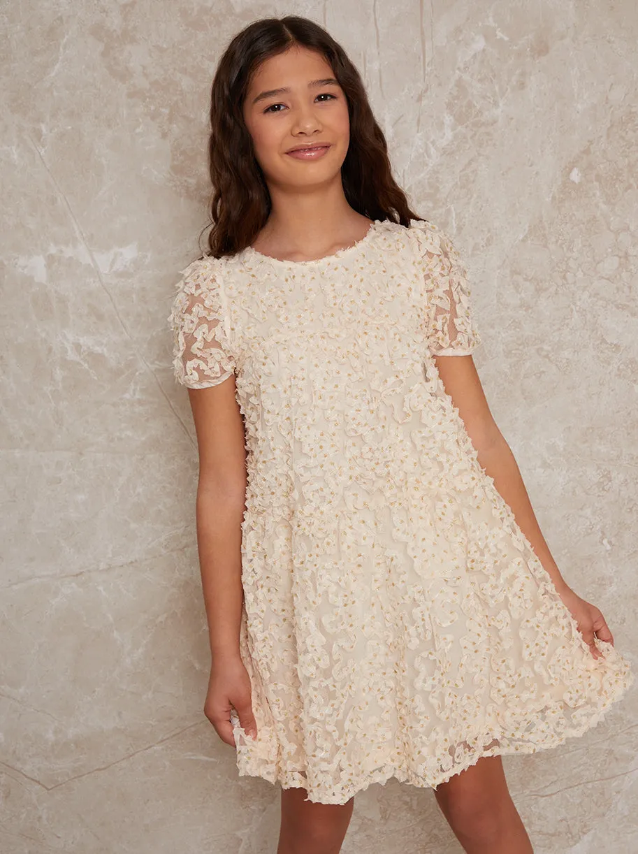 Girls Textured Metallic Polka Dot Dress in Cream sold by Chi Chi London