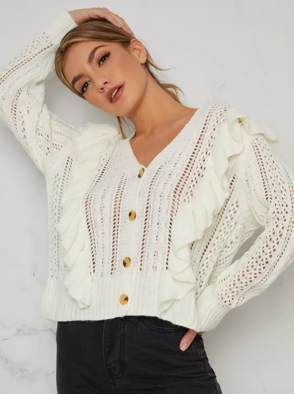Ruffle Detail Knitted Cardigan In Cream sold by Chi Chi London