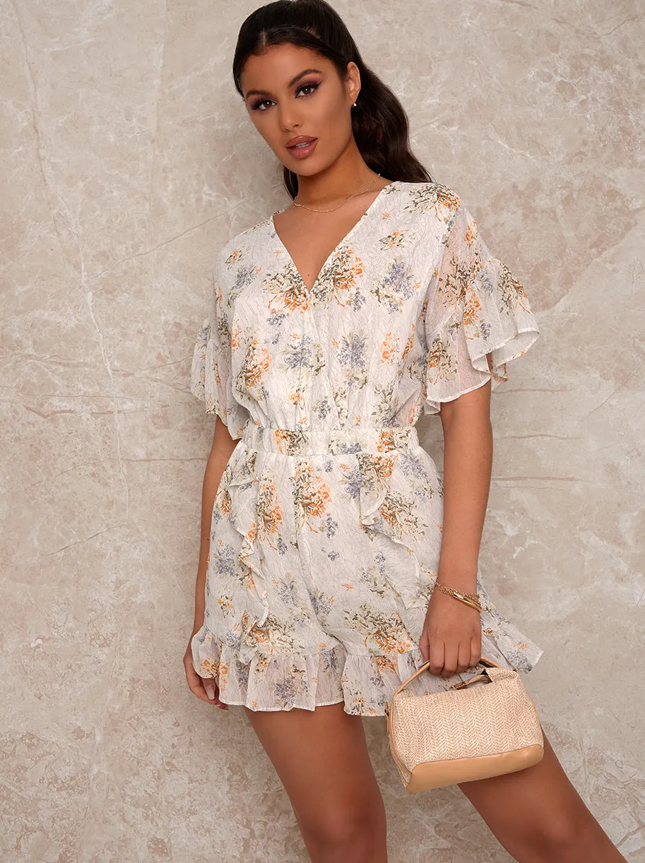 Ruffle Trim Floral Playsuit in White sold by Chi Chi London