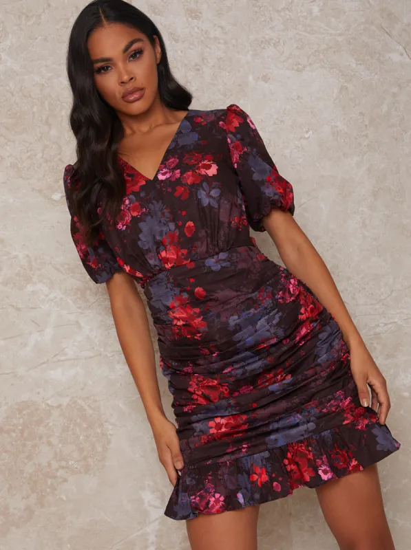 V Neck Ruched Floral Mini Dress in Black sold by Chi Chi London